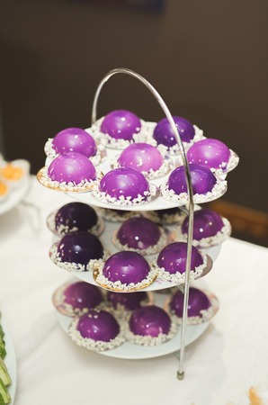 Different kinds of baked sweets on a buffetの写真素材