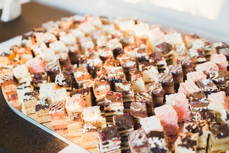 Delicious sweets on wedding candy buffet with desserts, cupcakesの写真素材