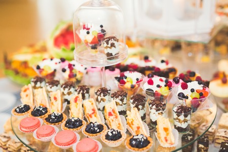 Different kinds of baked sweets on a buffetの写真素材