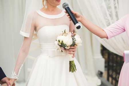 Wedding couple bride and groom holding handsの写真素材