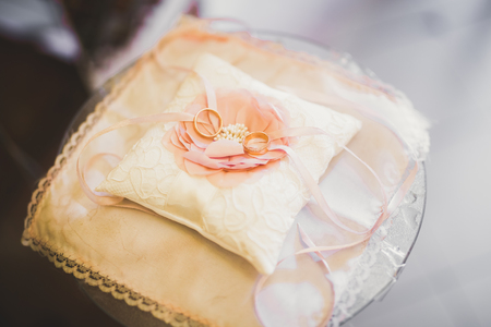 Wedding rings on ceremony at church. Macro.の写真素材