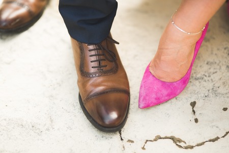 Legs bridal, groom wearing shoes, brides moccasinsの写真素材