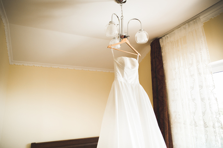 The perfect wedding dress in the room of the brideの写真素材