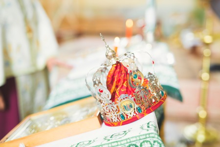 Golden crowns lying on the table in churchの写真素材