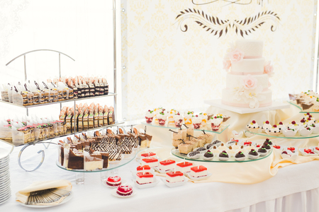 Different kinds of baked sweets on a buffetの写真素材