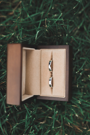 Two golden wedding rings isolated background conceptの写真素材