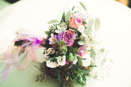Beautiful wedding bouquet with different flowers, rosesの写真素材