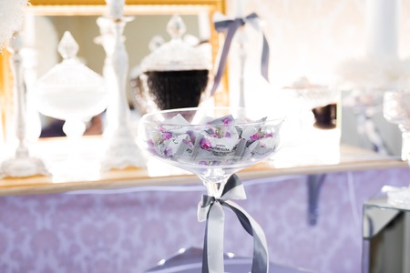 Delicious sweets on wedding candy buffet with desserts, cupcakesの写真素材