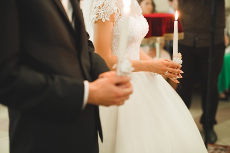 Wedding couple bide and groom get married in a churchの写真素材