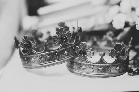 Golden crowns lying on the table in churchの写真素材