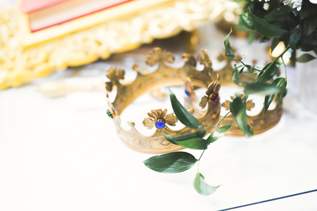 Golden crowns lying on the table in churchの写真素材