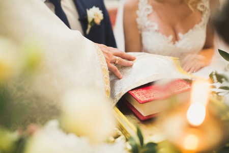 Wedding couple bide and groom get married in a churchの写真素材