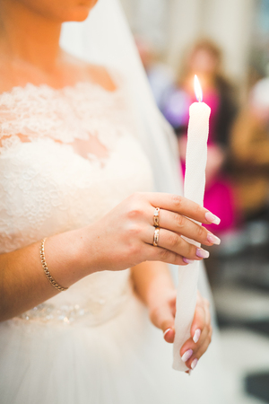 Married couple posing in a church after ceremonyの写真素材