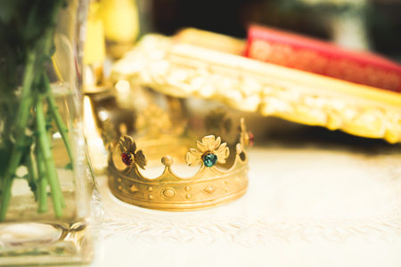 Golden crowns lying on the table in churchの写真素材