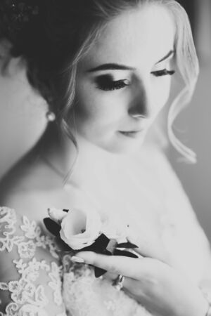 Portrait of beautiful bride with fashion veil at wedding morningの写真素材