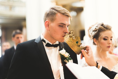 Wedding couple bide and groom get married in a churchの写真素材