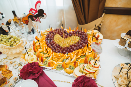 Delicious sweets on wedding candy buffet with desserts, cupcakesの写真素材