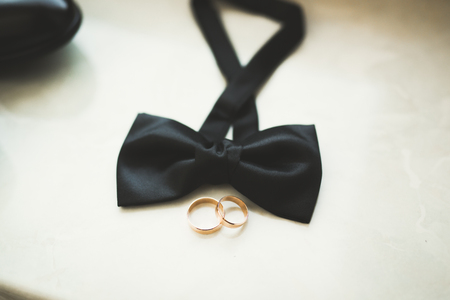 Two golden wedding rings isolated background conceptの写真素材