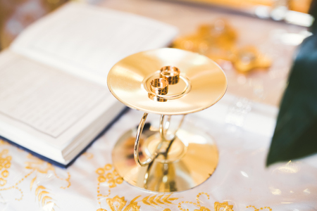 Wedding rings on ceremony at church. Macro.の写真素材