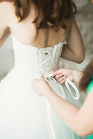 Portrait of beautiful bride with fashion veil at wedding morningの写真素材