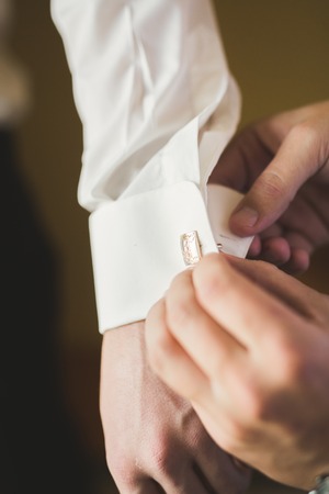 Beautiful man, groom posing and preparing for weddingの写真素材