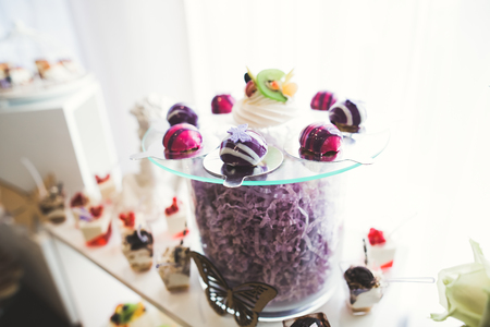 Different kinds of baked sweets on a buffetの写真素材