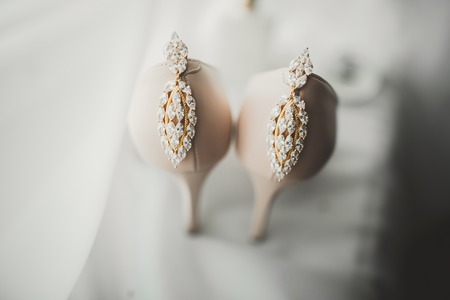 White stylish wedding shoes for bride. Close-up