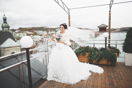 Portrait of stunning bride with long hair posing with great bouquetの写真素材
