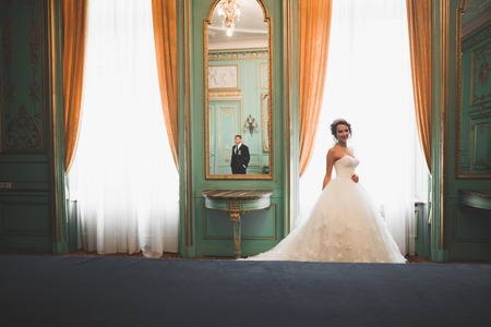 Luxury married wedding couple, bride and groom posing in old cityの写真素材