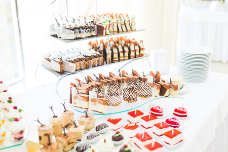 Different kinds of baked sweets on a buffetの写真素材