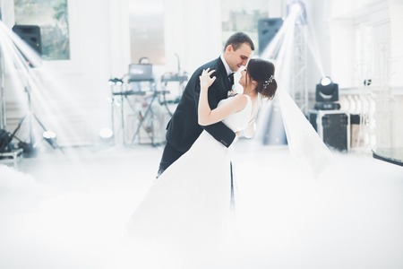 Beautiful wedding couple just married and dancing their first danceの写真素材