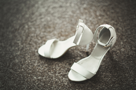 White stylish wedding shoes for bride. Close-upの写真素材