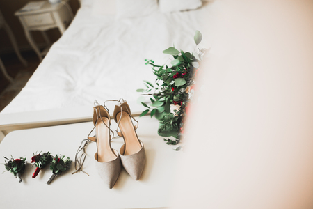 White stylish wedding shoes for bride. Close-up.の写真素材