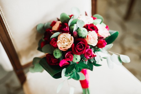 Beautiful wedding bouquet with different flowers, roses.の写真素材
