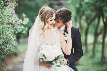 Sensual portrait of a young wedding couple. Outdoorの写真素材