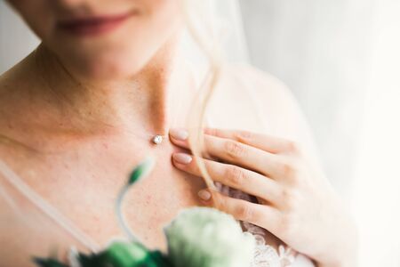 Portrait of stunning bride with long hair posing with great bouquetの写真素材