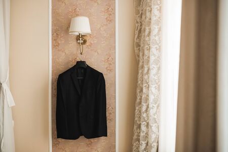 Stylish groom suit in dressing room indoors.の写真素材