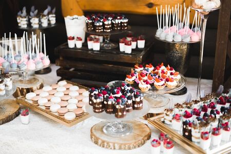 Buffet with a variety of delicious sweets, food ideas, celebration.の写真素材