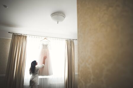 The perfect wedding dress in the room of the bride.の写真素材