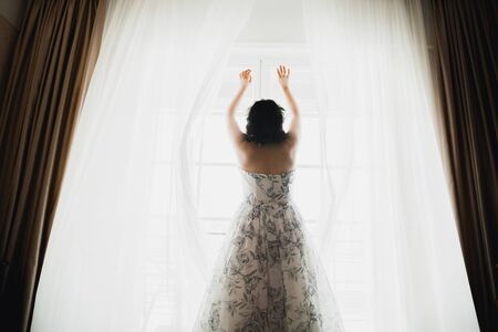 Portrait of beautiful bride with fashion veil at wedding morningの写真素材