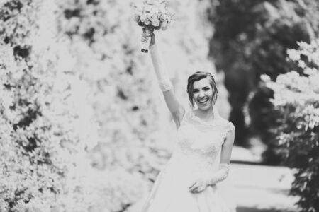 Portrait of stunning bride with long hair posing with great bouquetの写真素材