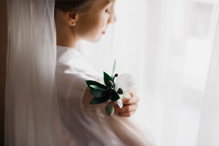 Portrait of stunning bride with long hair posing with great bouquet.の写真素材