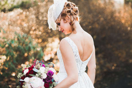 Bride holding big and beautiful wedding bouquet with flowers