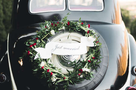 Wedding car decorated with beautiful, luxury flowersの写真素材