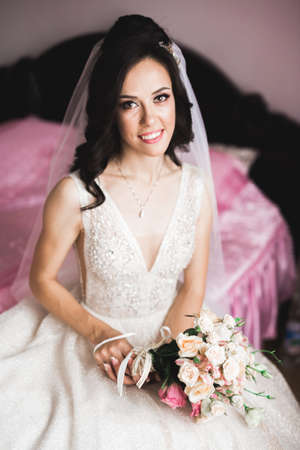 Bride holding big and beautiful wedding bouquet with flowersの写真素材