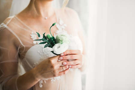 Portrait of stunning bride with long hair posing with great bouquetの写真素材