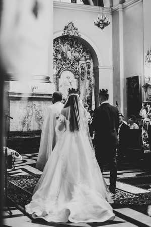 Wedding couple bide and groom get married in a churchの写真素材