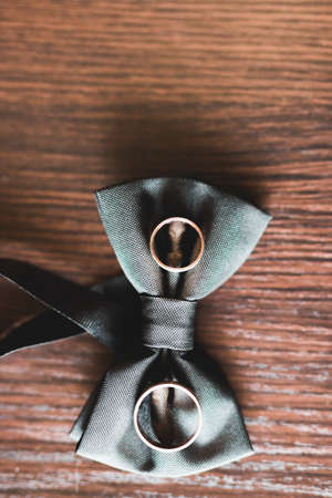 Two golden wedding rings isolated background conceptの写真素材