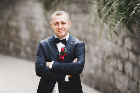 Headshot portrait of young man smiling isolated on outside outdoors background