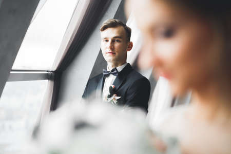 Headshot portrait of young man smiling isolated on outside outdoors backgroundの写真素材